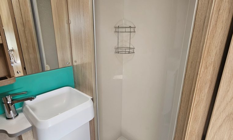Interior view of the Auto-Trail F-Line F62 motorhome bathroom with handbasin and modern design.