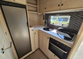 Compact Auto-Trail F-Line F62 motorhome kitchen with fridge, oven and smart storage cupboards