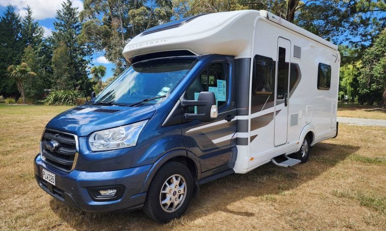 2022 Pre-owned Auto-Trail F-Line F74 4-berth motorhome, exterior view of the front and habitation door.