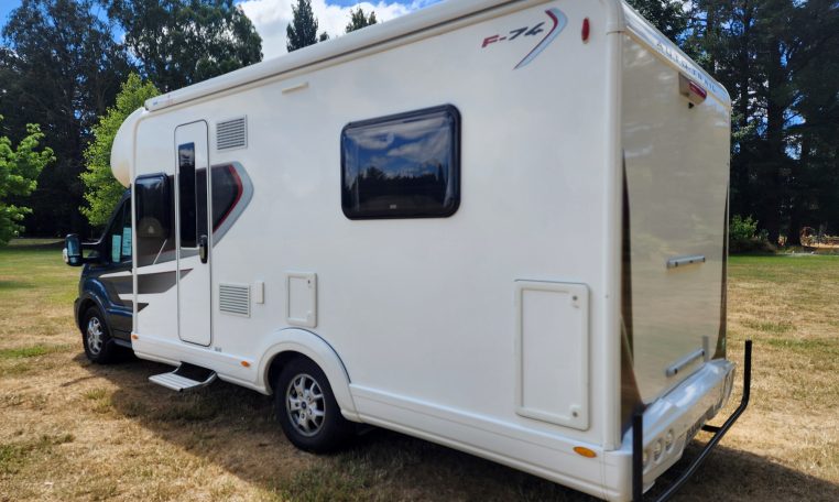 Pre-owned 2022 Auto-Trail F-Line F74 4-berth motorhome, exterior view of the entry steps and habitation door.