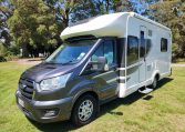 Exterior profile of the 2022 Pre-owned Auto-Trail F-Line F74 motorhome showing side view, windows, and overall design layout.