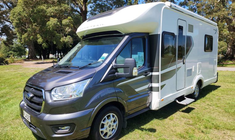 Exterior profile of the 2022 Pre-owned Auto-Trail F-Line F74 motorhome showing side view, windows, and overall design layout.