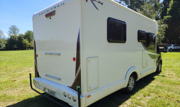 2022 Pre-owned Auto-Trail F-Line F74 4-berth motorhome, exterior view of the back and driver's side.