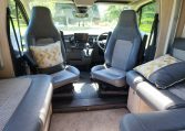 Cab swivel seats in a 2022 Auto-Trail F-Line F74 motorhome, rotating driver and passenger seats to face the living area for added comfort.