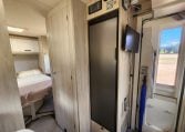 Pre-owned 2022 Auto-Trail F-Line F74 4-berth motorhome, interior view of the control panel and closed fridge.