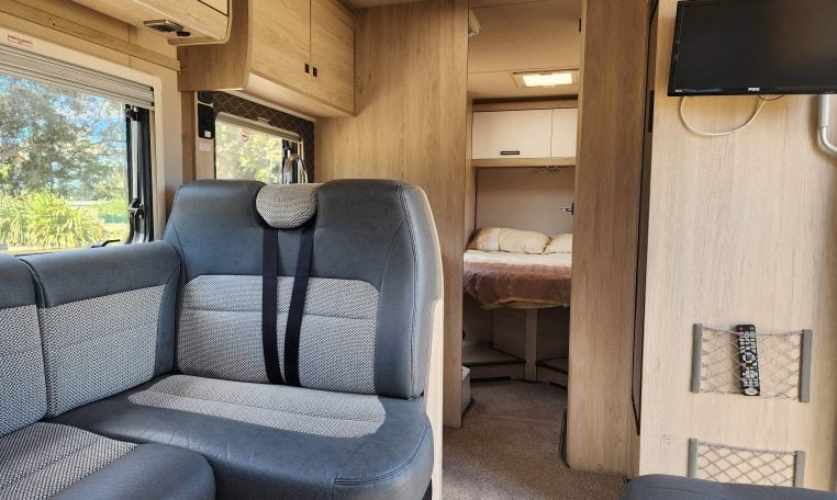 Pre-owned 2022 Auto-Trail F-Line F74 4-berth motorhome, interior view of the passenger seats with seatbelts.