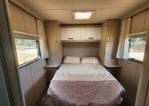 Pre-owned 2022 Auto-Trail F-Line F74 4-berth motorhome, interior view of the spacious fixed rear island bed.