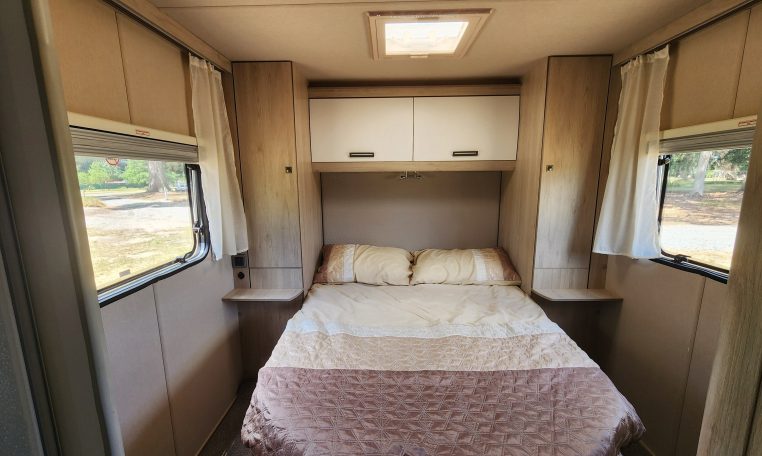 Pre-owned 2022 Auto-Trail F-Line F74 4-berth motorhome, interior view of the spacious fixed rear island bed.