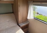 2022 Auto-Trail Imala 730 motorhome interior showing the bedroom cupboard for convenient and tidy clothing storage.