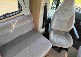 2022 Auto-Trail Imala 730 motorhome interior showing the cab swivel seats providing extra seating in the living space.