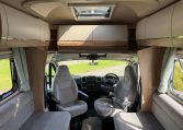 2022 Auto-Trail Imala 730 motorhome interior showing the front lounge skylight bringing in natural light.