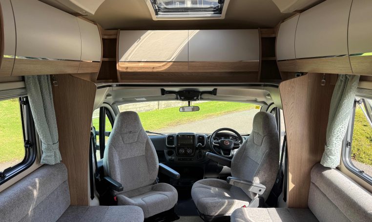 2022 Auto-Trail Imala 730 motorhome interior showing the front lounge skylight bringing in natural light.