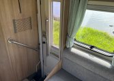 2022 Auto-Trail Imala 730 motorhome interior showing the convenient handrail at the entrance.