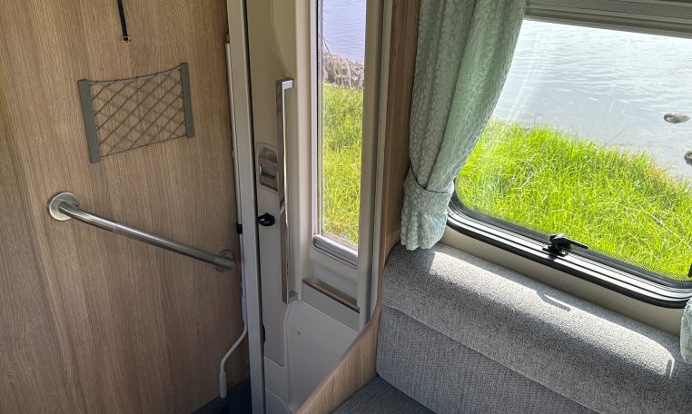 2022 Auto-Trail Imala 730 motorhome interior showing the convenient handrail at the entrance.