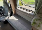 2022 Auto-Trail Imala 730 motorhome interior showing the luxury fabric upholstery.