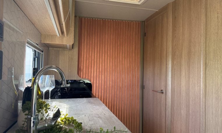 2022 Auto-Trail Imala 730 motorhome interior showing the bedroom door, providing privacy from the main living area.