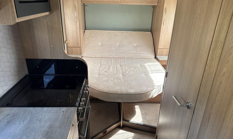 2022 Auto-Trail Imala 730 motorhome interior showing the spacious rear bedroom with an island bed.