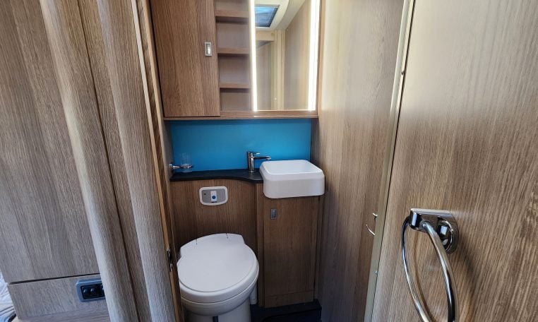 2022 Auto-Trail Tracker RB motorhome interior view of the toilet and handbasin.