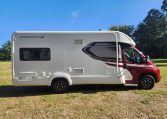 Side view of a 2022 Auto-Trail Tracker RL motorhome showing the driver's door.