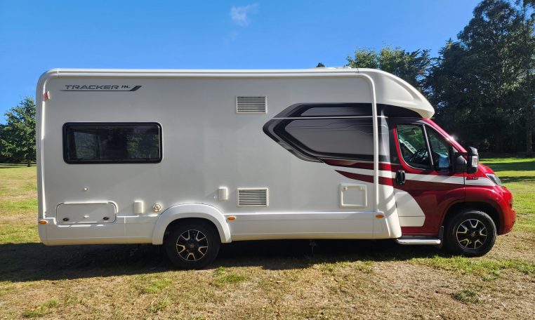 Side view of a 2022 Auto-Trail Tracker RL motorhome showing the driver's door.