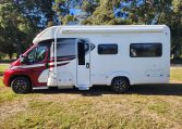Exterior view of the 2022 Auto-Trail Tracker RL showing habitation door and awning for outdoor use.