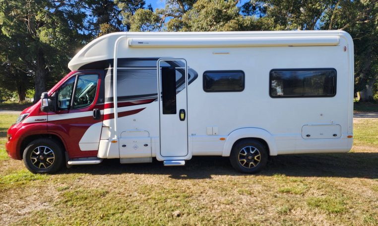 Exterior view of the 2022 Auto-Trail Tracker RL showing habitation door and awning for outdoor use.