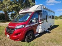 Exterior profile of the 2022 Auto-Trail Tracker RL motorhome showing side view, windows, and overall design layout.