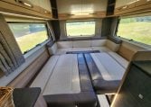 Rear lounge area in the 2022 Auto-Trail Tracker RL converting into a comfortable bed for flexible living.