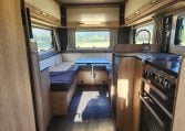 Overhead storage cabinets in a 2022 Auto-Trail Tracker RL motorhome rear lounge, offering smart and efficient storage.