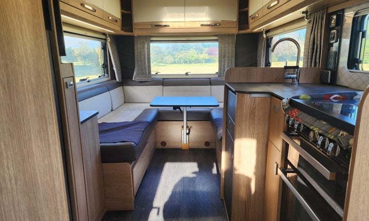Overhead storage cabinets in a 2022 Auto-Trail Tracker RL motorhome rear lounge, offering smart and efficient storage.