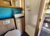 Separate shower unit in the 2022 Auto-Trail Tracker RL motorhome, offering privacy and modern amenities.