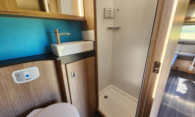 Separate shower unit in the 2022 Auto-Trail Tracker RL motorhome, offering privacy and modern amenities.
