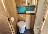 Clean, compact toilet setup in the 2022 Auto-Trail Tracker RL, designed for comfort and space efficiency.