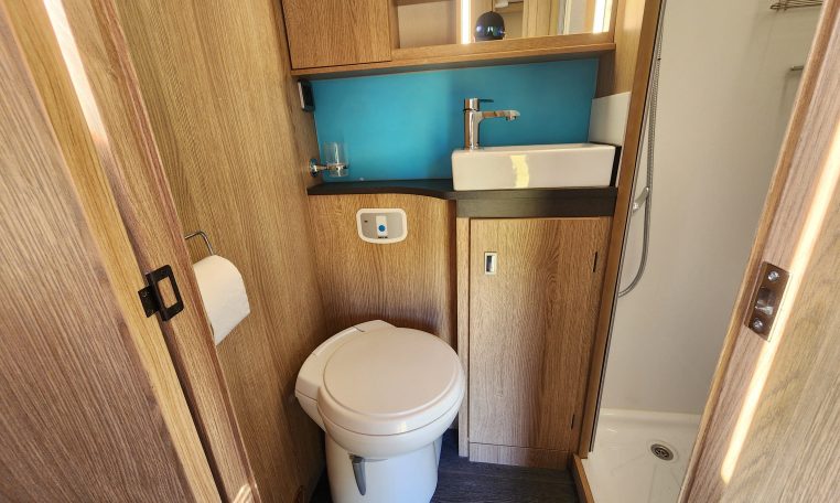 Clean, compact toilet setup in the 2022 Auto-Trail Tracker RL, designed for comfort and space efficiency.