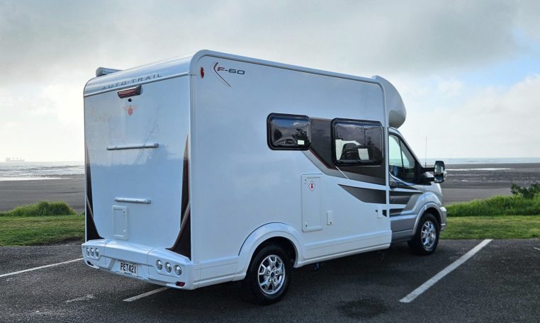 2022 Auto-Trail F-Line F-60 exterior showing the rear and driver's side.