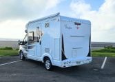 2022 Auto-Trail F-Line F-60 exterior showing the rear and passenger side.
