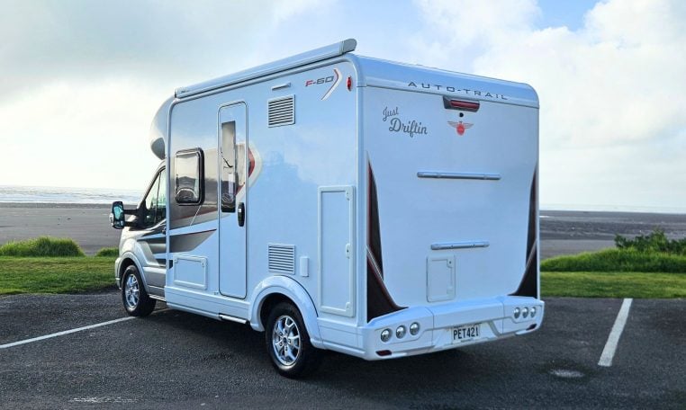2022 Auto-Trail F-Line F-60 exterior showing the rear and passenger side.