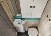 2022 Auto-Trail F-Line F-60 interior showing the compact motorhome bathroom with toilet, hand basin and separate shower.