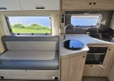 2022 Auto-Trail F-Line F-60 interior showing the bench seating in the front lounge.