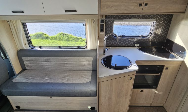 2022 Auto-Trail F-Line F-60 interior showing the bench seating in the front lounge.