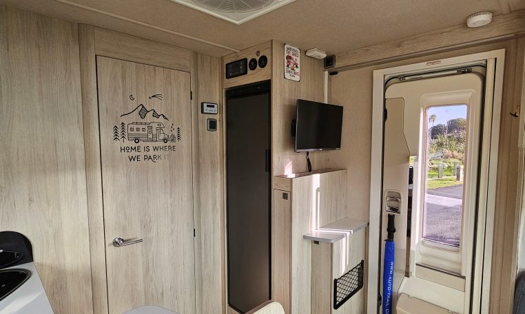 2022 Auto-Trail F-Line F-60 interior showing the tall fridge in the kitchen.