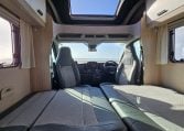 2022 Auto-Trail F-Line F-60 interior showing the front lounge converting into a bed.