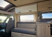2022 Auto-Trail F-Line F-60 interior showing the front lounge overhead storage.