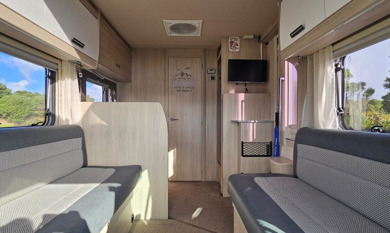 2022 Auto-Trail F-Line F-60 interior showing the lounge and kitchen layout.