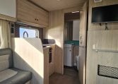 2022 Auto-Trail F-Line F-60 interior showing the TV in the front lounge.