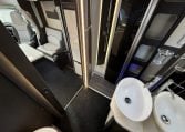 2022 Ci Magis 66XT interior view showing the bathroom and double sink.