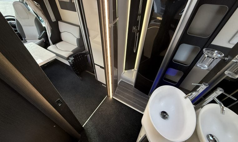 2022 Ci Magis 66XT interior view showing the bathroom and double sink.