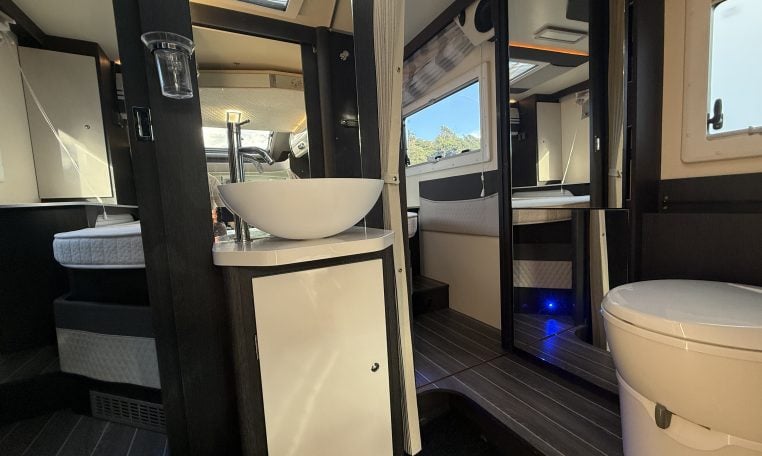 2022 Ci Magis 66XT interior view showing the hand basin in the bathroom.
