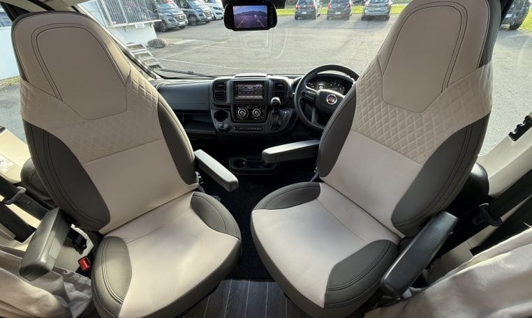 2022 Ci Magis 66XT interior view showing the comfortable swivel cab seats.