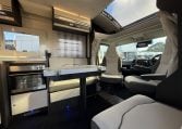 2022 Ci Magis 66XT interior view of the spacious front dining area with comfortable seating.